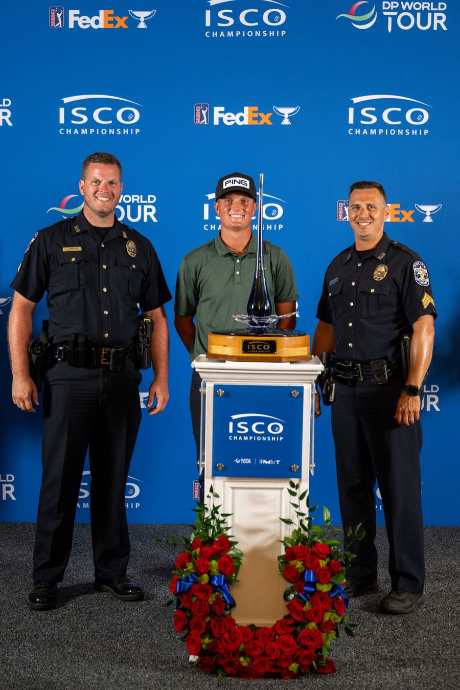 Joe Keeling and a fellow officer with the champion at the 2025 ISCO Championship trophy presentation